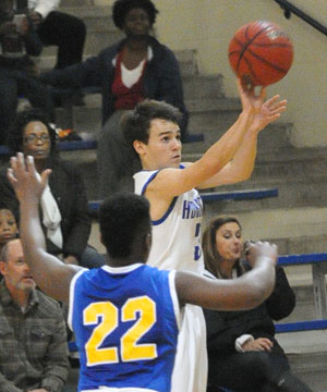 Henry Terry (3) fires a 3-pointer. (Photo by Kevin Nagle)