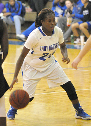 Kalia Walker drives into the lane. (Photo by Kevin Nagle)