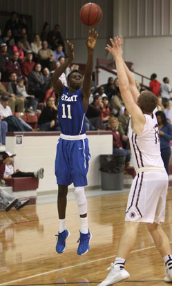 Kevin Hunt fires up a jumper over Benton's Westin Riddick. (Photo by Rick Nation)