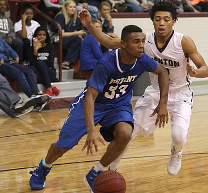 Romen Martin (33) drives around Benton's Chase Anderson. (Photo by Rick Nation)