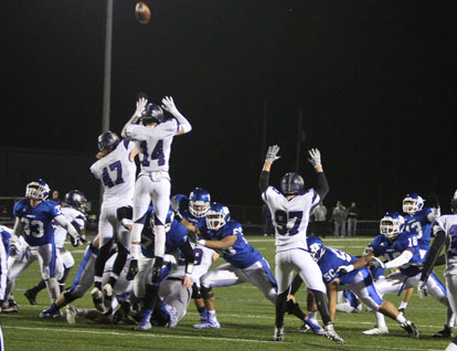 Hayden Ray kicks his 13th field goal of the season, matching the school's single-season record. (Photo by Rick Nation)