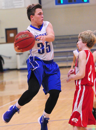 Cade Brennan (35) looks to get a pass past a Cabot North player. (Photo by Kevin Nagle)