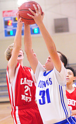 Jonathan Hall (31) pulls down one of his 11 rebounds. (Photo by Kevin Nagle)