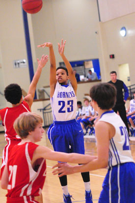 Kayla West launches a shot. (Photo by Kevin Nagle)