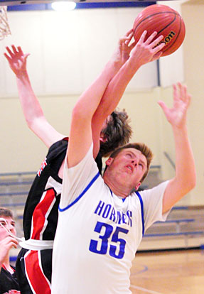 Blaise Smith (35) battles for a rebound. (Photo by Kevin Nagle)