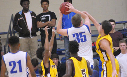 Blaine Smith goes up for a shot as teammate Josh Robinson (21) looks on. (Photo by Kevin Nagle)