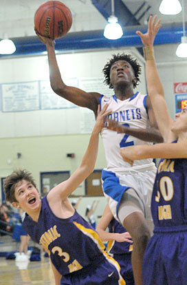Rodney Lambert drives to the hoop. (Photo by Kevin Nagle)