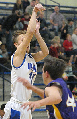 Tyler O'Neal follows through on a 3-point attempt. (Photo by Kevin Nagle)