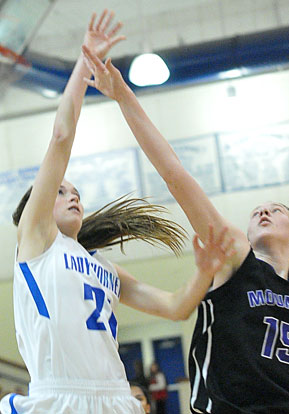 Mary Catherine Selig shoots over Mount St. Mary defender Allison Allgood. (Photo by Kevin Nagle)