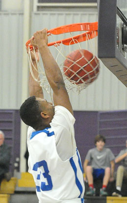Romen Martin finishes off a dunk. (Photo by Kevin Nagle)
