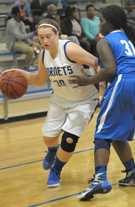 Cali Rogers (30) tries to drive around a Conway Blue defender. (Photo by Kevin Nagle)
