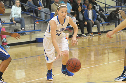 Meagan Chism starts a drive to the basket. (Photo by Kevin Nagle)