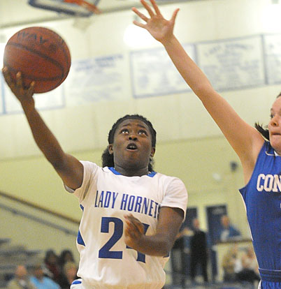 Kali Walker tries to get a shot around a Conway Blue defender. (Photo by Kevin Nagle)