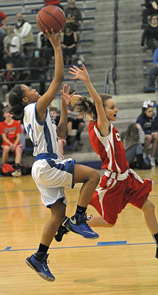 Jaiyah Jackson avoids a Cabot South defender on the way to the basket. (Photo by Kevin Nagle)
