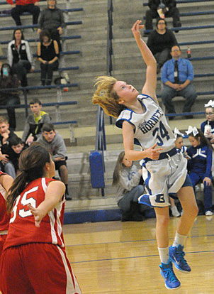Kaitlyn Weng (34) goes up for a layup. (Photo by Kevin Nagle)