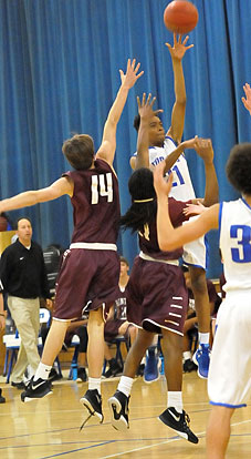 Josh Robinson (21) unleashes a shot. (Photo by Kevin Nagle)