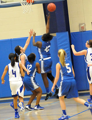 Bryant White's MeKeycia Baker goes up for a lay-in. (Photo by Kevin Nagle)