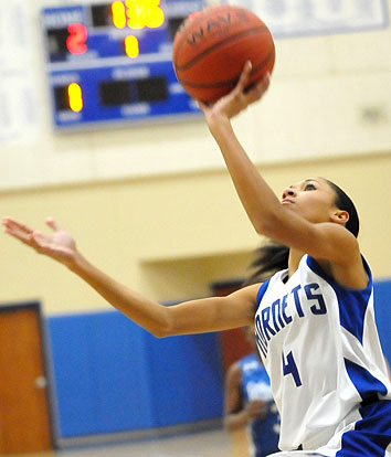 Bryant Blue's Jada Deaton finishes off a drive to the hoop. (Photo by Kevin Nagle)