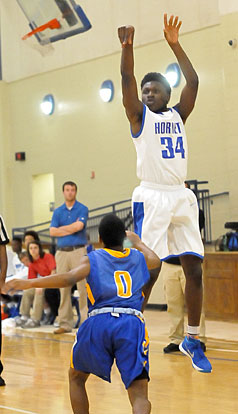 Randy Thomas releases a shot from the 3-point line. (Photo by Kevin Nagle)