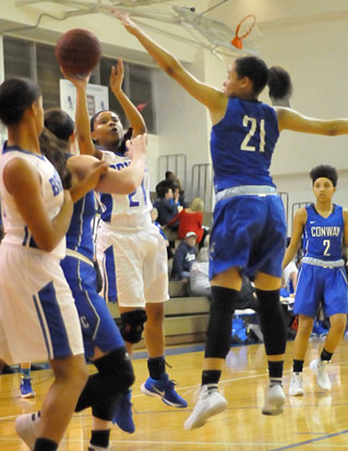 Destiny Martin tries to evade Conway's Brianna Wells as she takes a shot. (Photo by Kevin Nagle)