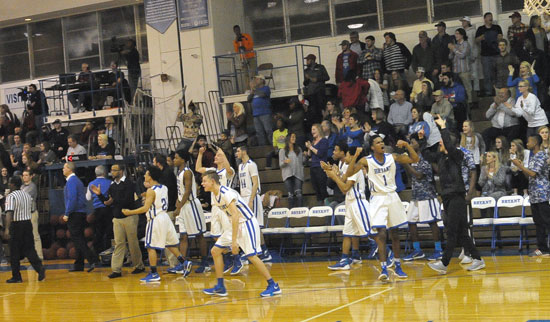 Bryant's bench celebrates the 54-53 victory as the buzzer ends Tuesday's game. (Photo by Kevin Nagle)