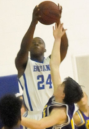 Marvin Moody (24) elevates to pull down a rebound. (Photo by Kevin Nagle)