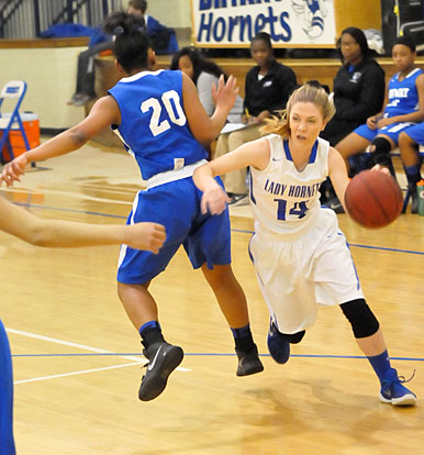 Meagan Chism drives around a Conway White defender. (Photo by Kevin Nagle)