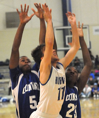 Tyler O'Neal tries to get a shot off against a pair of Conway White defenders. (Photo by Kevin Nagle)