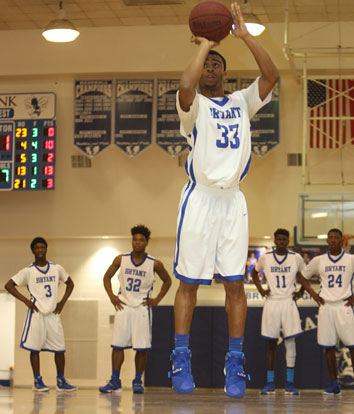 Romen Martin shoots free throws after a technical as his teammates wait on the other end of the court. (Photo by Rick Nation)