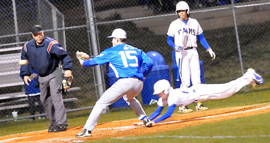 Ty Medford covers the plate as a Lakeside base-running scores on a wild pitch. (Photo by Kevin Nagle)