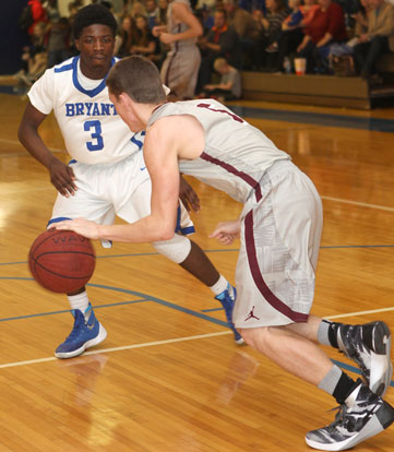 Calvin Allen (3) defends against Siloam Springs guard Jordan Norberg. (Photo by Rick Nation)