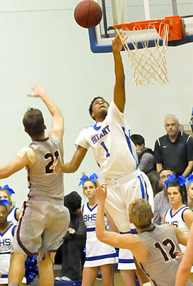 Bryant senior Detavious Moore drives to the hoop past Siloam Springs' Noah Karp (21). (Photo by Kevin Nagle)