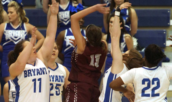 Bryant seniors Carolyn Reeves (11), Anna Turpin (25), Annie Patton and Taylor Hill (22) surround Siloam Springs' Abby Cox early in Friday's game. (Photo by Rick Nation)