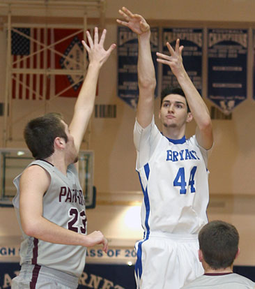 Kyle Sahr shoots over Siloam Springs' Kyle Comiskey (23). (Photo by Rick Nation)