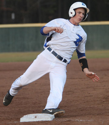 Aaron Orender rounds third on his way to scoring in the bottom of the third inning on Monday night. (Photo by Rick Nation)