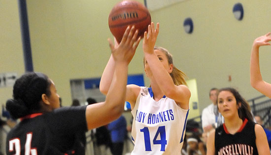 Meagan Chism (14) shoots over Russellville's Makayla Ealy. (Photo by Kevin Nagle)