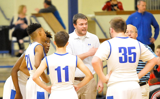 Coaches Tyler Posey and David Grady instruct during a break in Thursday's game. (Photo by Kevin Nagle)