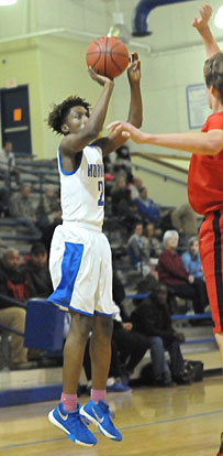 Rodney Lambert releases a jumper as a Russellville defender jumps out on him. (Photo by Kevin Nagle)