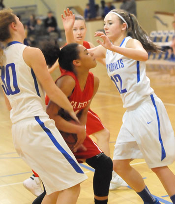 Megan Lee (12) and Allie Dugan (30) double-team a Cabot Red player. (Photo by Kevin Nagle)