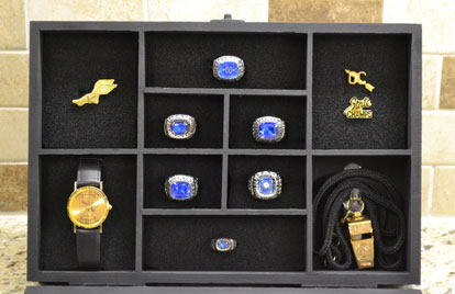 A Christmas gift from his wife Vicki, this case displays Coach Danny Westbrook's State championship jewelry.