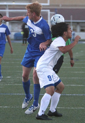 Martin Ramierez (99) battles a Conway player for control of the ball. (Photo by Rick Nation)