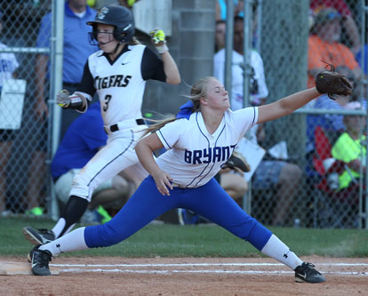 Mallory Theel stretches for a throw at first base just win time to retire Bentonville's Jenna Wildeman. (Photo by Rick Nation)