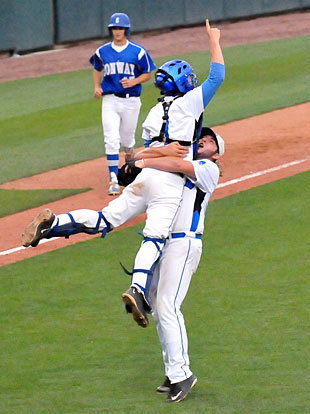 Catcher Dylan Hurt leaps into the arms of pitcher Zach Jackson to start Bryant's State championship celebration. (Photo by Kevin Nagle)