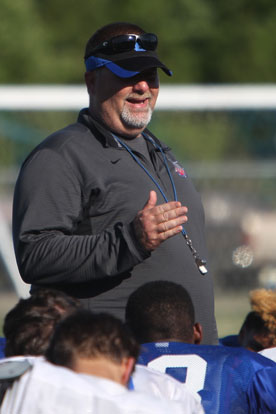 Bryant head coach Buck James talks to his team after a recent spring workout. (Photo by Rick Nation)