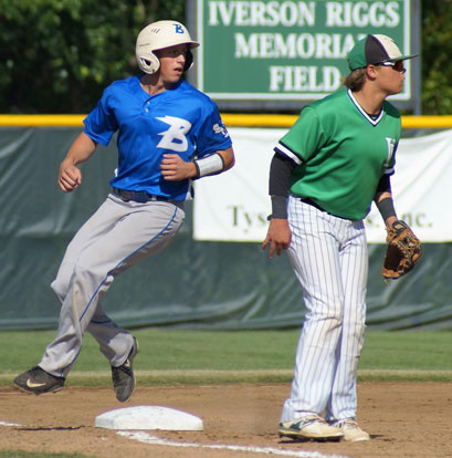 Logan Allen rounds third behind Van Buren's Trevor Johnson as he looks to see the result of the play at first. (Photo courtesy of Paul Dotson)