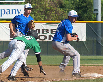 Pitcher Evan Lee, right, clips first base with his toe after taking a toss from first baseman Aaron Orender, left, to retire Van Buren's Landry Wilkerson. (Photo courtesy of Paul Dotson)