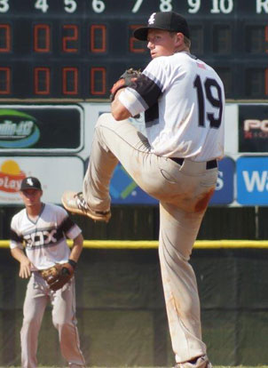 Logan Allen winds up as shortstop Jake East sets up defensively at shortstop. (Photo courtesy of Paul Dotson)