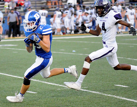 Bryant safety Mike Jones intercepts a pass behind Fayetteville's Kris Mulinga. (Photo by Kevin Nagle)