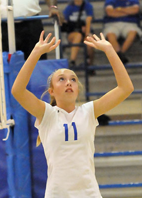 Abbey Inman sets for a teammate. (Photo by Kevin Nagle)