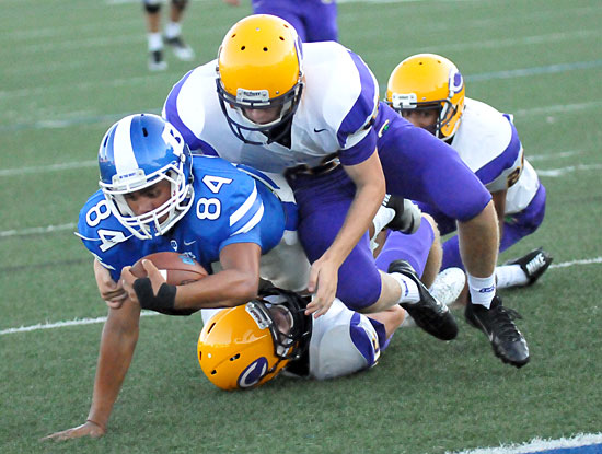 Bryant's C.J. Wallace (84) stretches for extra yardage. (Photo by Kevin Nagle)